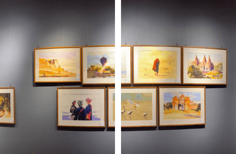 Gallery wall lined with framed artworks