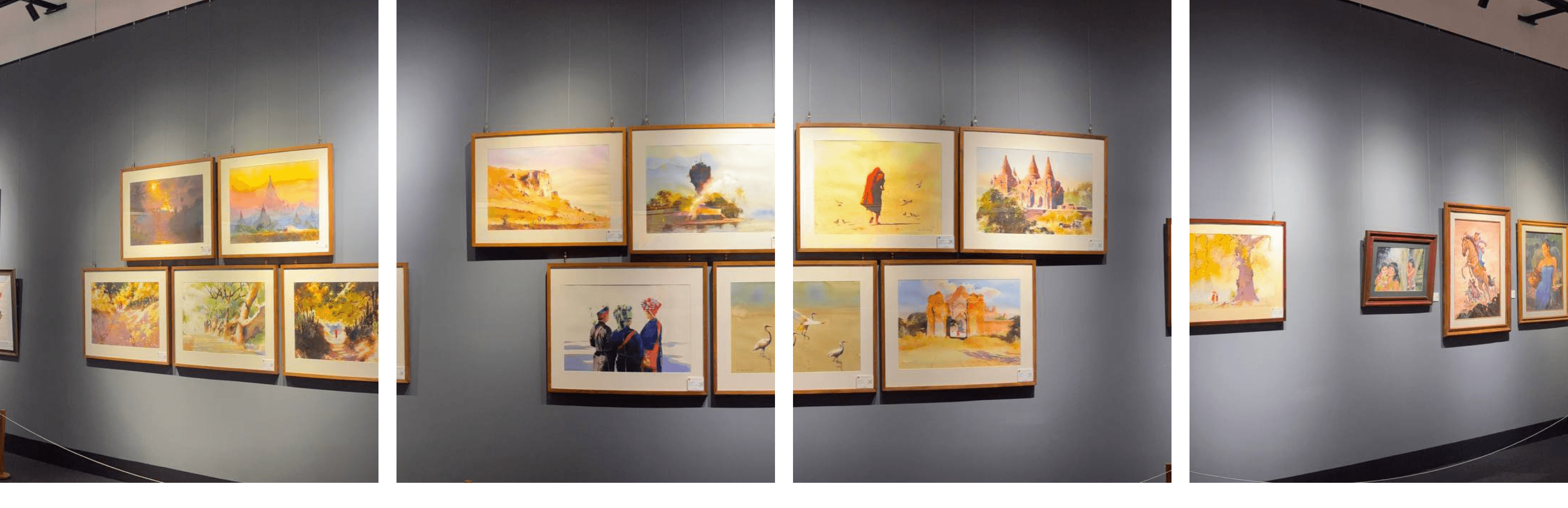 Gallery wall lined with framed artworks